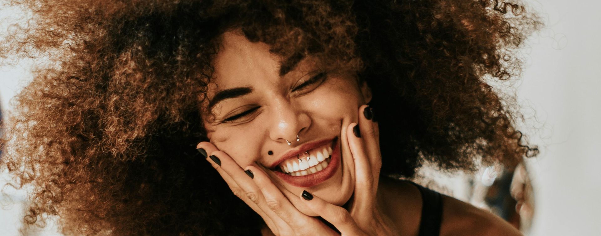 Woman Sitting And Smiling